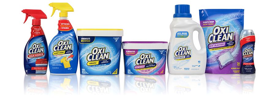 Lineup of OxiClean laundry additive powders, liquid laundry boosters, power paks, and pretreatment sprays.